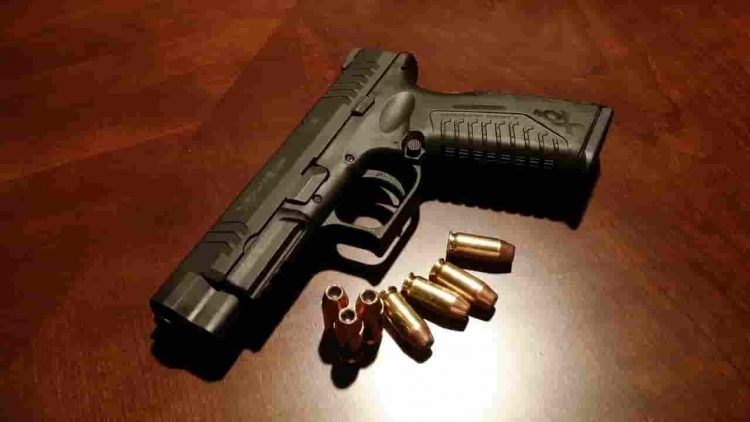 a loaded handgun with ammunition