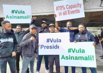 vula president - a group of protesters holding placards